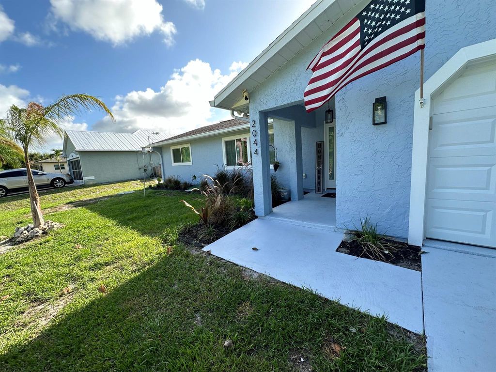 Photo of 2044 SE Crowberry Drive, Port Saint Lucie, FL 34983 (MLS # R10998250)