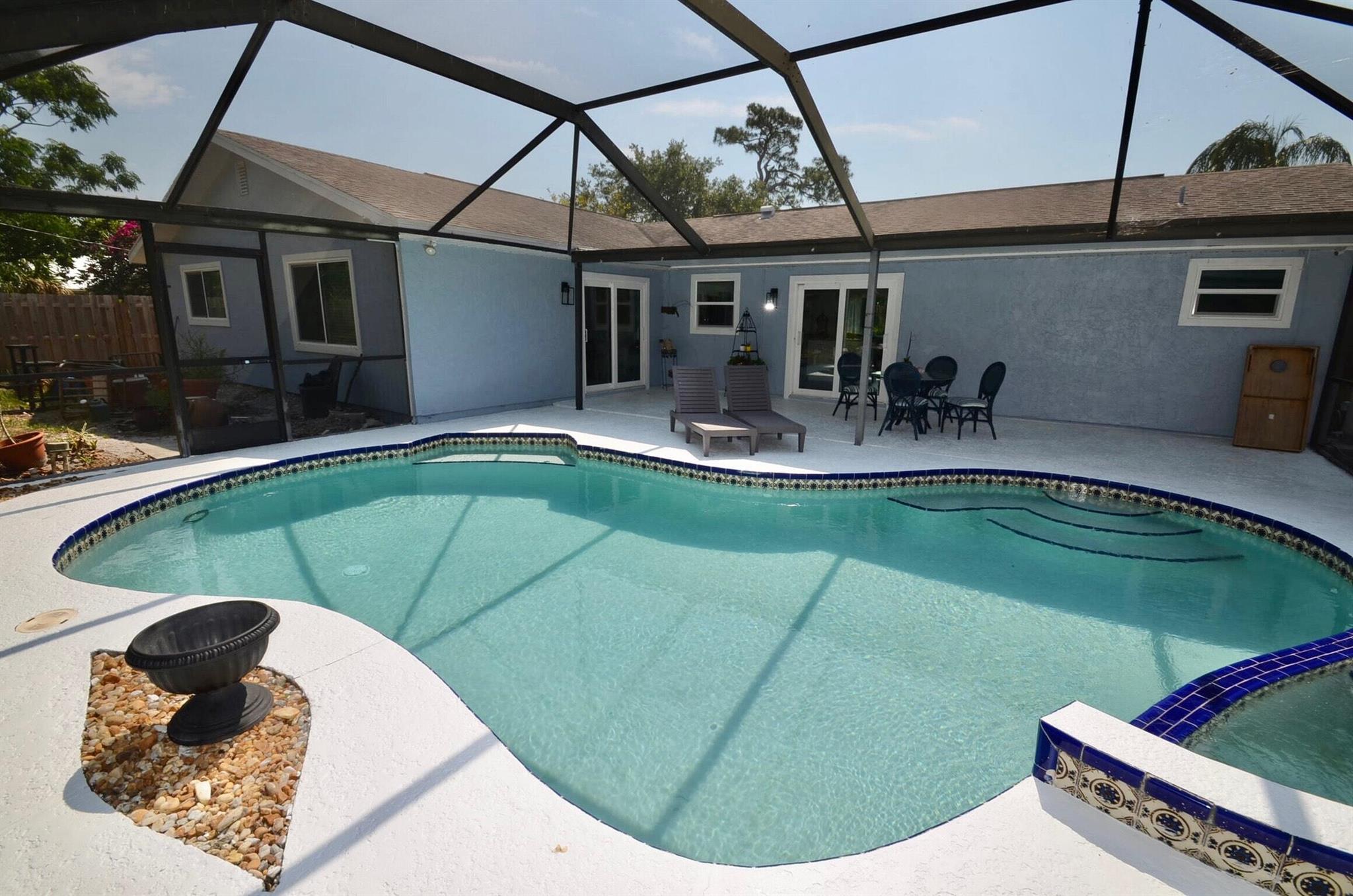 Multiple offers rec- ALL OFFERS IN BY WED NOON-answer by Wed 5pm. FULLY REMODELED 3/2/2 new floors, ceilings, kitchen, AC, WH & bathrooms. ALL impact windows & doors, pool (child proof fence), new fence & driveway extension, interior & exterior paint, new interior doors & baseboards. 2 family rooms, plenty of storage, & HUGE laundry room under AC (not incl in sq footage). Roof 9/2011. Home is across from the river, (no homes) so a view of the preserves & a quiet street make this home a WONDERFUL investment! The home is around the corner from Floresta EL, a true community school. There IS a well on property for future irrigation. Owners unexpectedly relocating out of state. Light, bright & beautiful. Step in and listen...this home is calling you...Welcome home!