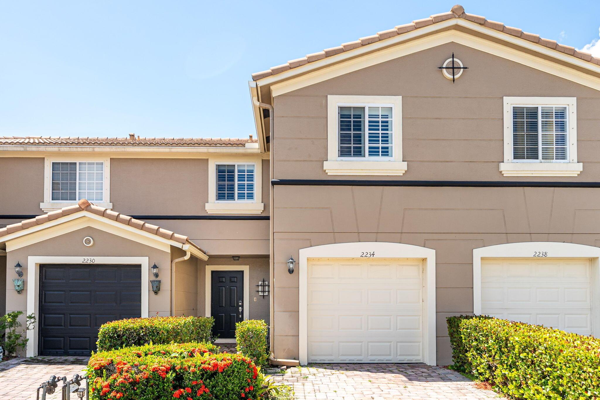 Welcome to this stunning two-story townhouse located in Newport Village. With 3 Bedrooms 2.5 baths and a 1 car garage, this home has a lot to offer at 1,490 sqft. This listing combines style, comfort, and security, featuring impact glass windows and doors for peace of mind year-round. Step inside to a spacious open-concept living area. The bright kitchen flows seamlessly into the dining and living spaces, making it ideal for entertaining or relaxing. Upstairs you'll find three comfortable bedrooms, with a serene primary suite. Enjoy tranquil mornings or peaceful sunsets from your screened-in porch overlooking the lake. Additional features include a one-car garage, modern finishes, and access to community amenities. Perfectly located near shopping, dining, and major roadways and tradition.