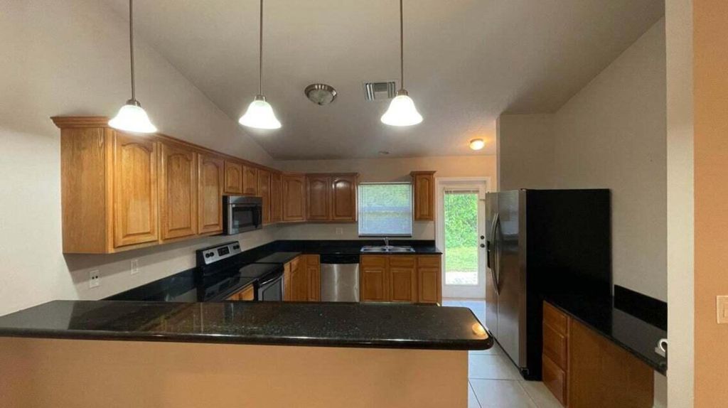 Photo of 6007 Bamboo Dr, Fort Pierce, FL 34982 (MLS # R11044423)