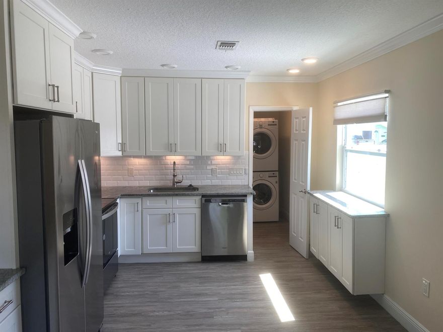 Beautifully Renovated home on large fenced lot. Centrally located in the city of Vero Beach home has 3 Bedrooms, 2 Baths, metal roof, impact windows, Stainless Steel Appliances, laundry room, large storage shed, spacious eat-in Kitchen, all New Vinyl floors, walk-in closets, Electric Fire Place and large patio. Bring your large Pets. Available Dec. 1st. Landscaping included in rent.