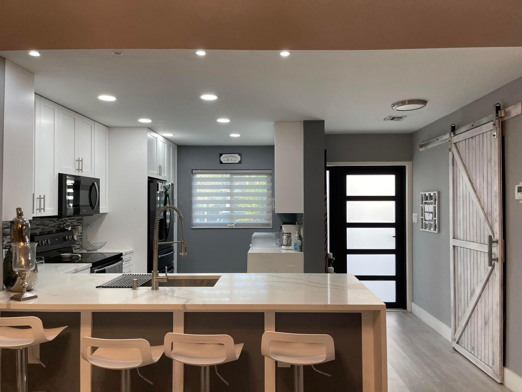 Photo of 1816 Tamarind Lane, Coconut Creek, FL 33063 (MLS # R11141347)