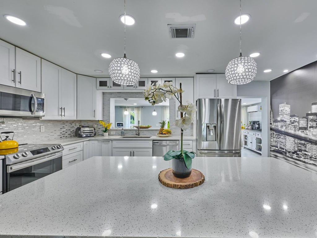 Photo of 9020 SW 8th Street, Boca Raton, FL 33433 (MLS # B26080763)