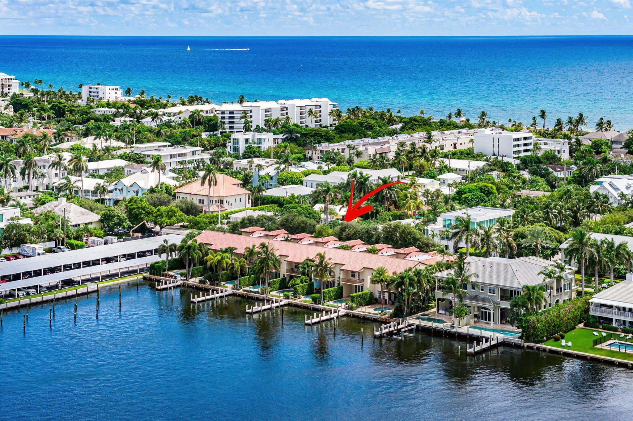 A true haven for boating enthusiasts, this Beach Area townhome offers 30 feet of direct Intracoastal frontage and a 40-foot dock accommodating vessels up to 55 feet. Spanning 4,654+/- square feet, the residence blends Mediterranean-inspired architecture with modern refinement, showcasing marble and wood floors, graceful archways, intricate moldings, and warm design accents. Light-filled interiors flow from the formal living room to the expansive great room, where French doors open to a private pool patio framing breathtaking sunset views over the Intracoastal. The chef's kitchen is beautifully reimagined with custom cabinetry, a breakfast nook, Wolf gas range and convection steam oven, SubZero refrigerator, and Miele dishwasher.