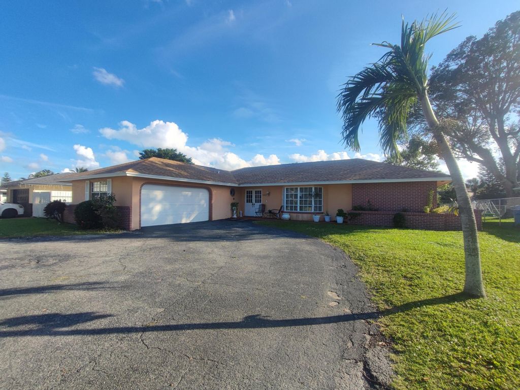 Photo of 152 Sandpiper Avenue, Royal Palm Beach, FL 33411 (MLS # R10908604)