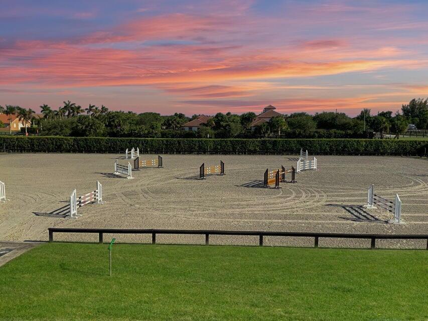 Incredible offering just 0.5 mile to WEF South Gate! Scooter or Golfcart to the showgrounds in under a minute and enjoy the tree lined effortless hack!! This gorgeous facility has an amazing all weather ring 150'x230 & is one of largest in the area! New GGT footing laser leveled by Wordley Martin, New Wordley Martin drag, new John Deere tractor ready for you! Property has 8 lush paddocks (2 mini paddocks), lunge ring & full set of 18 jumps to exceed your potential. There are 2 tack rooms w/ AC, rider's lounge, and a beautiful new covered gazebo w/ fan, lights, speakers, new flyspray sys throughout barns! Elegant matching pole barn & 1 apt avail for season! Owner has inclusive, kind, professional environment. Yourself and your horses will be very happy here.