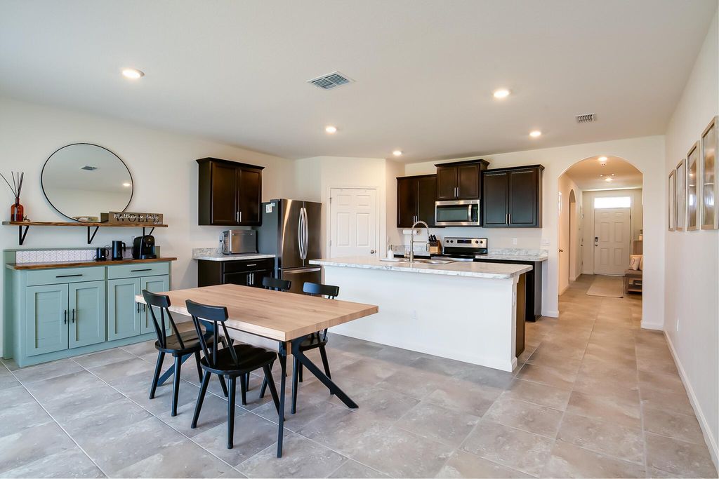 Photo of 414 SE Fairchild Avenue, Port Saint Lucie, FL 34984 (MLS # R11110347)