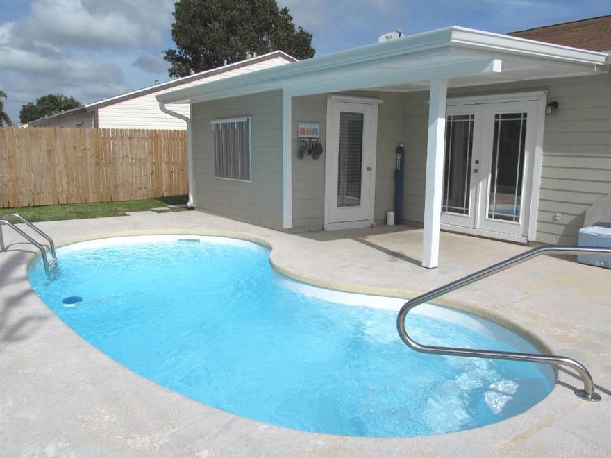 BEAUTIFULLY UPDATED 3/2 COMPLETELY TILED FENCED POOL HOME W/ NEW GUTTERS  IN  DESIRABLE COUNTRYWOOD!  NO CARPET HERE!  NEW ROOF & A/C IN 2012.  LITE & BRITE W/VAULTED CEILINGS & FRENCH DOORS LEADING TO COVERED PATIO & 20FT FREE FORM POOL PERFECT FOR RELAXATION & ENTERTAINING.  CANAL  JUST BEYOND  FENCED PROPERTY OFFERS  MAXIMUM PRIVACY. KITCHEN BOASTS WOOD CABINETRY, GRANITE COUNTERS, TILE BACK-SPLASH & STATE OF THE ART STAINLESS APPLIANCES., INCLUDING BRAND NEW FRIDGE, HOT WATER HEATER, & FRONT LOADING W&D.. BONUS RM BOASTS EXTERIOR ENTRANCE LOCATED OFF KITCHEN USED AS DEN/OFFICE CAN BE CONVERTED TO 4TH BDRM.   MSTR BDRM W/POCKET DR TO UPDATED BATH OFFERS DESIGNER TILED SHOWER & UPDATED VANITY. 2ND BATH, ALSO W/POCKET DR & TUB IS UPDATED.  KIDS WILL LOVE COMMUNITY PLAY AREA OFF LAKE!