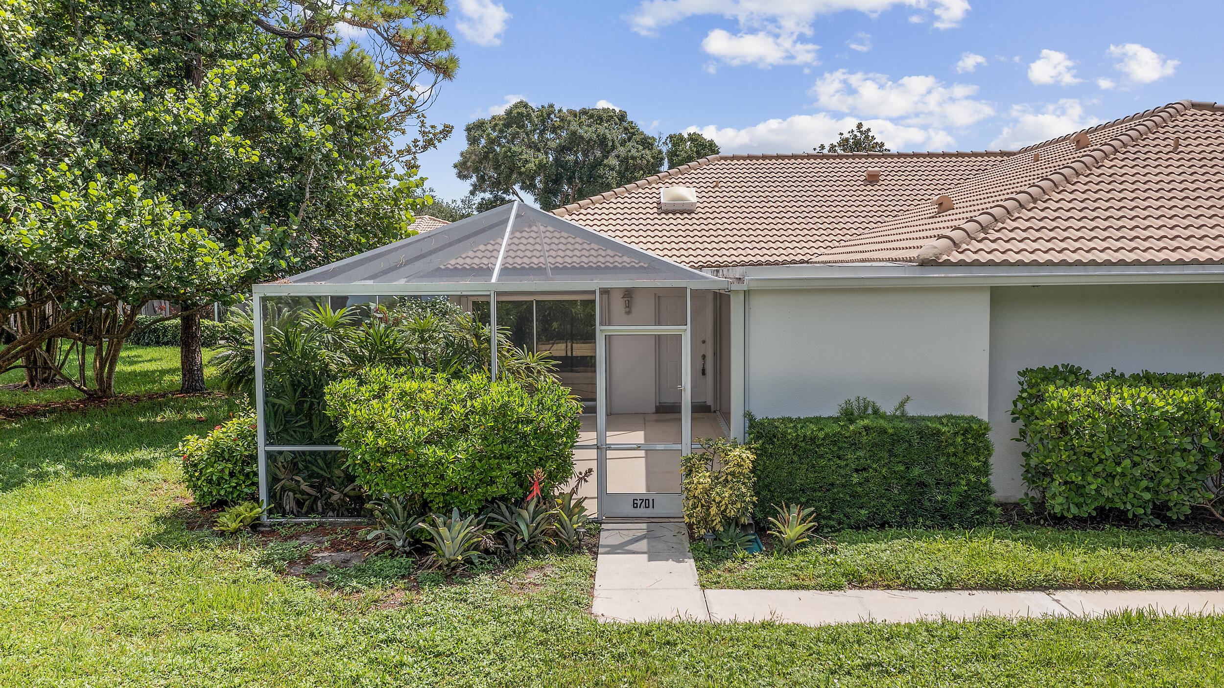 Desirable Sunterrace community of Palm Beach Gardens. Step inside to find an open and inviting layout featuring granite countertops, tile and laminate flooring, and plenty of natural light. The spacious living area flows seamlessly to the private screened courtyard, perfect for outdoor dining, entertaining, or simply enjoying the peaceful garden setting. This home boasts a barrel tile roof for added durability and curb appeal. Both bedrooms are generously sized, providing comfort and privacy for residents and guests alike. Perfectly located, you're just minutes from the beach, The Gardens Mall, and easy access to I-95, putting all of Palm Beach County at your fingertips.Searching for a primary residence, seasonal retreat, or investment opportunity, this townhouse fits the bill!