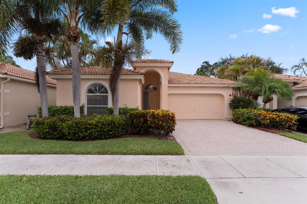 Welcome to this beautiful pool home offering an amazing outdoor living space and an array of desirable features. Situated on a canal lot in Delray Beach, this residence boasts 3 bedrooms, 2 bathrooms, and a 2-car garage within a gated community. Step inside and be greeted by a spacious floorplan with volume ceilings, creating an open and airy ambiance. The large kitchen is a chef's delight, featuring stainless steel appliances, an eat-in area, and an extended bar for additional seating. Tiled floors throughout the home provide a stylish touch, with plank-style flooring adding warmth to the bedrooms. The master bedroom overlooks the pool, creating a serene retreat. It boasts two closets, including a walk-in, and has a convenient door leading to the patio. The master bathroom features...