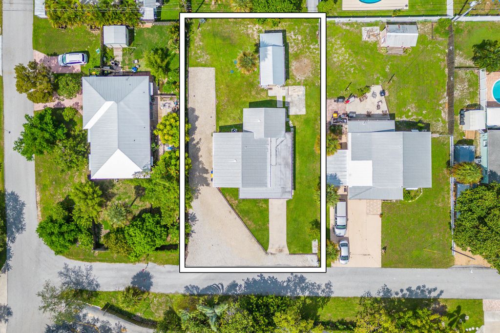 Photo of 1593 NE Orion Street, Jensen Beach, FL 34957 (MLS # R11090898)