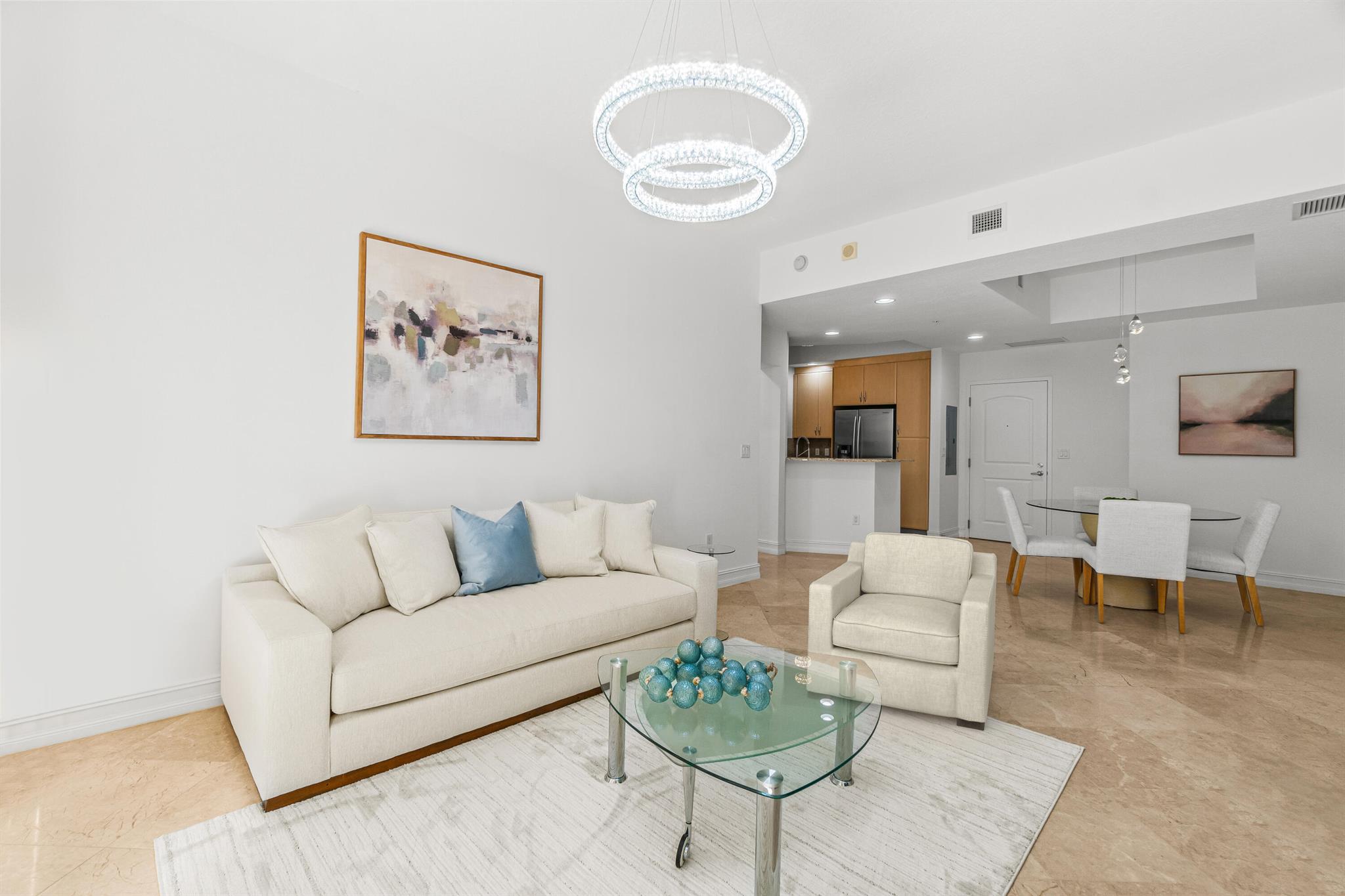 Discover the epitome of luxury living in the iconic Two City Plaza Luxury building in the heart of downtown West Palm Beach. This pristine residence features 2 bedrooms and 2 baths, including a premium garage parking space on Mez level. Relax and recharge with soft modern surroundings with new furnishings and decor that feel both chic and welcoming. The main living areas offer elegant marble flooring, freshly painted, and new lighting. Enjoy ultra-high ceilings and a light-open kitchen with light granite countertops to give this residence a spacious airy-feel. Recent upgrades include a newer HVAC system, water heater, washer/dryer and hardware. The master suite is a sanctuary with new hardwood flooring, new lighting and a spacious bathroom featuring dual sinks, vanity area, all-marble..