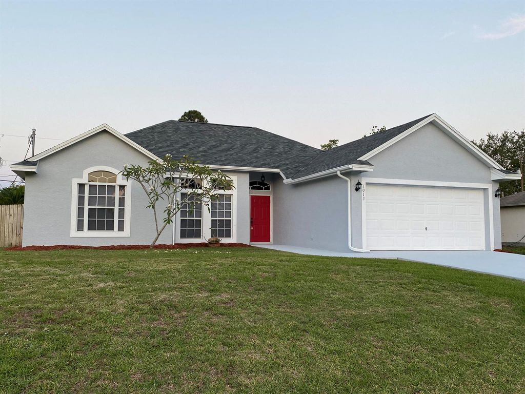 Photo of 1012 SW Longfellow Road, Port St Lucie, FL 34953 (MLS # R10889374)