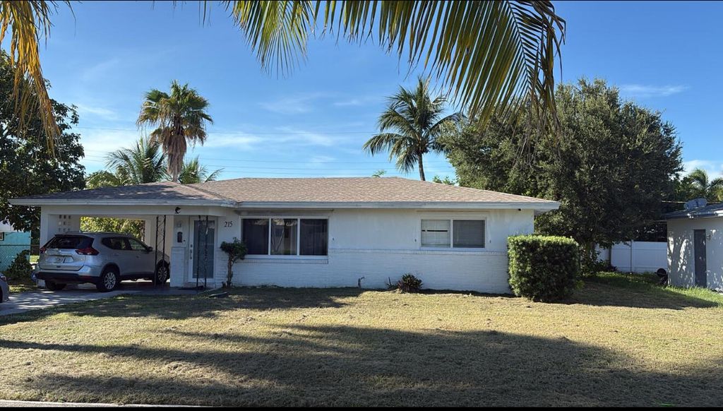 Photo of 215 Evergreen Drive, Lake Park, FL 33403 (MLS # R11121845)