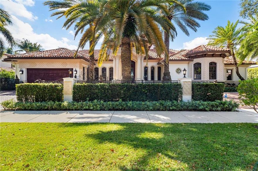 Elegant, custom built home with 125' of deep water frontage. Impact glass with high-end finishes throughout the home. Solid, mahogany doors, extensive use of marble and granite throughout. Home has an impressive office, den, gourmet kitchen with top of the line appliances. Temperature controlled wine cellar, Lutron Smart Home System controls & indoor/outdoor surround sound. Floor to ceiling built-ins, emergency generator. Home has 4 car garage (2 bays with lifts in place for 4 cars). Mediterranean- style dream home!