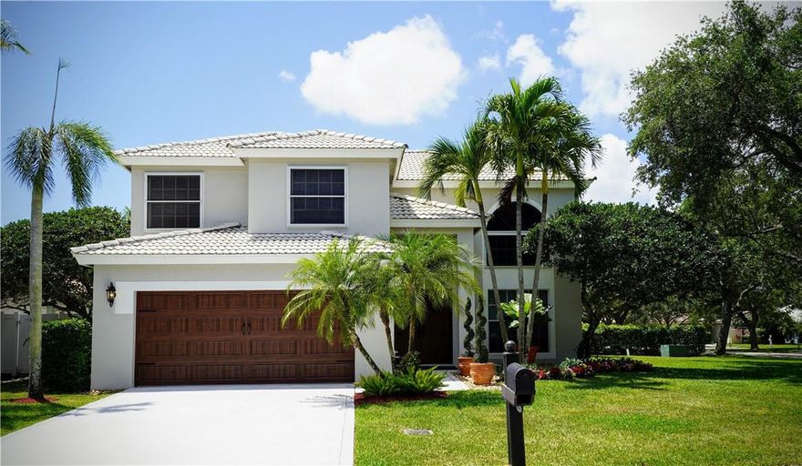 STUNNING 4-bed 2.5 bath home in Delray Beach! Newly painted exterior. 1st floor ceiling resurfaced in 2021; open kitchen w/ hardwood cherry cabinets; updated light fixtures including a Murano glass chandelier in living room; impact glass doors on 1st floor, impact screens on 2nd floor; impact 2-car garage door, impact double front door is Brazilian Mahogany. (Wind Mitigation report attached). Hand-scraped Acacia hardwood flooring in the bedrooms; remodeled primary bath in 2018 & half bath in 2017, all new toilets w/ self-closing seats; master and guest baths have night lit seats. AC & Water heater 6-7 years old; roof is original but well maintained. Heated community pool. Just minutes to Downtown Delray, the beach, public parks, shops & restaurants, w/ easy access to major expressways. Chandelier on patio no included, Blue curtains/drapes not included.