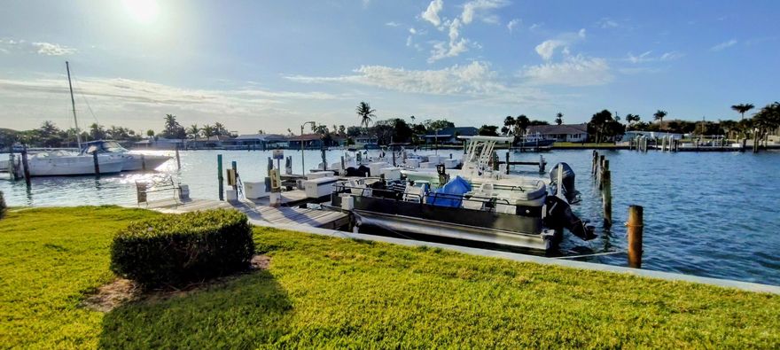 Welcome to coastal living at its finest in Fort Pierce, Florida! This stunning first-floor corner condominium is fully renovated with over $30,000 in upgrades. The unit boasts of granite kitchen countertops, luxury vinyl wood flooring & ample storage. Turnkey and professionally decorated. Move in ready. Enjoy breathtaking waterfront views, soak in every sunrise and relish the beauty of historical downtown Fort Pierce, home to the top-rated weekend farmers market. Enjoy your private marina—perfect for fishers & boat lovers. This home offers direct access to the Intracoastal and inlets. Don't miss your dream life and wise investment.  Exciting $600 million mixed-water resort near Fort Pierce-expected to draw over 200,000 visitors annually for its wave pool alone and about $2.6 million in annual revenue from surf activities, and the broader project is expected to bring a major tourism boost and create thousands of jobs. The city is investing in major projects, like a $10.25 million overhaul of "Indian River Drive" and a $21 million waterfront redevelopment called Marina Square. There's also a luxury mixed-use project, King's Landing, and a high-rise development on Hutchinson Island. All of this is boosting the city's appeal, especially for waterfront living.