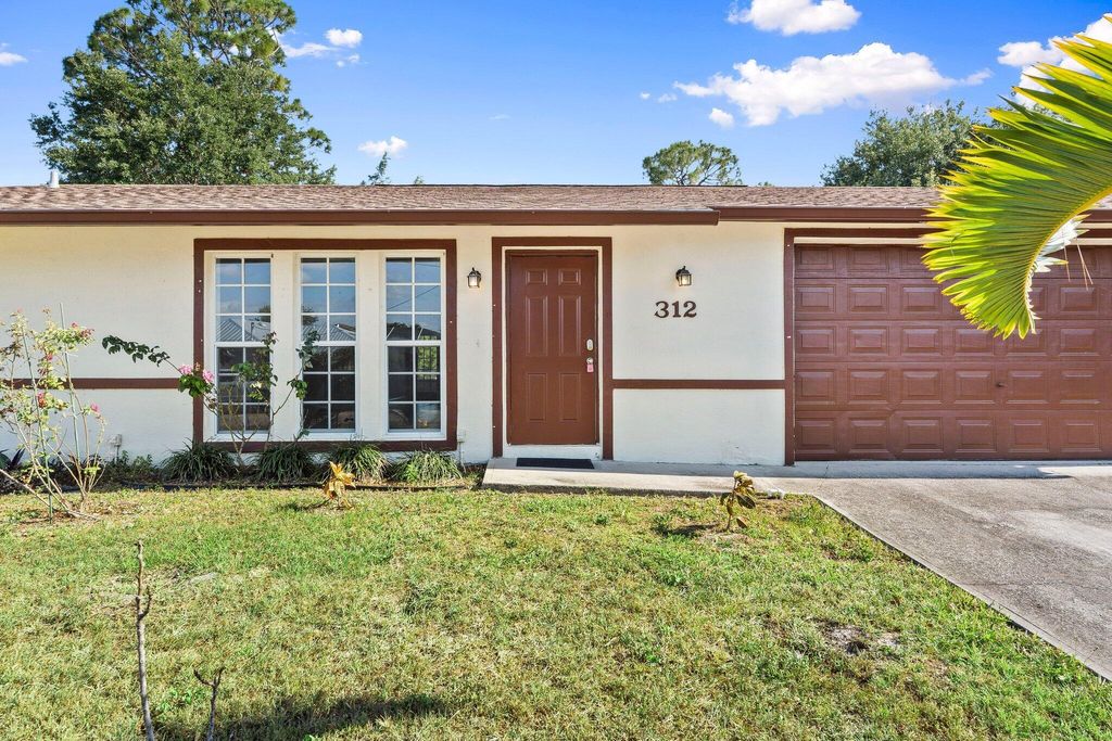 Photo of 312 SW Carter Avenue, Port Saint Lucie, FL 34983 (MLS # R11086249)
