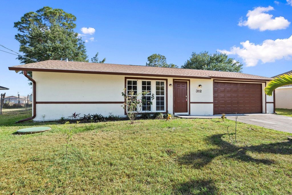 Photo of 312 SW Carter Avenue, Port Saint Lucie, FL 34983 (MLS # R11086249)