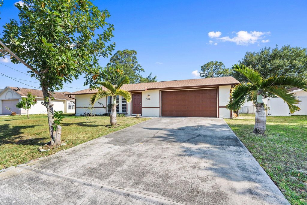 Photo of 312 SW Carter Avenue, Port Saint Lucie, FL 34983 (MLS # R11086249)