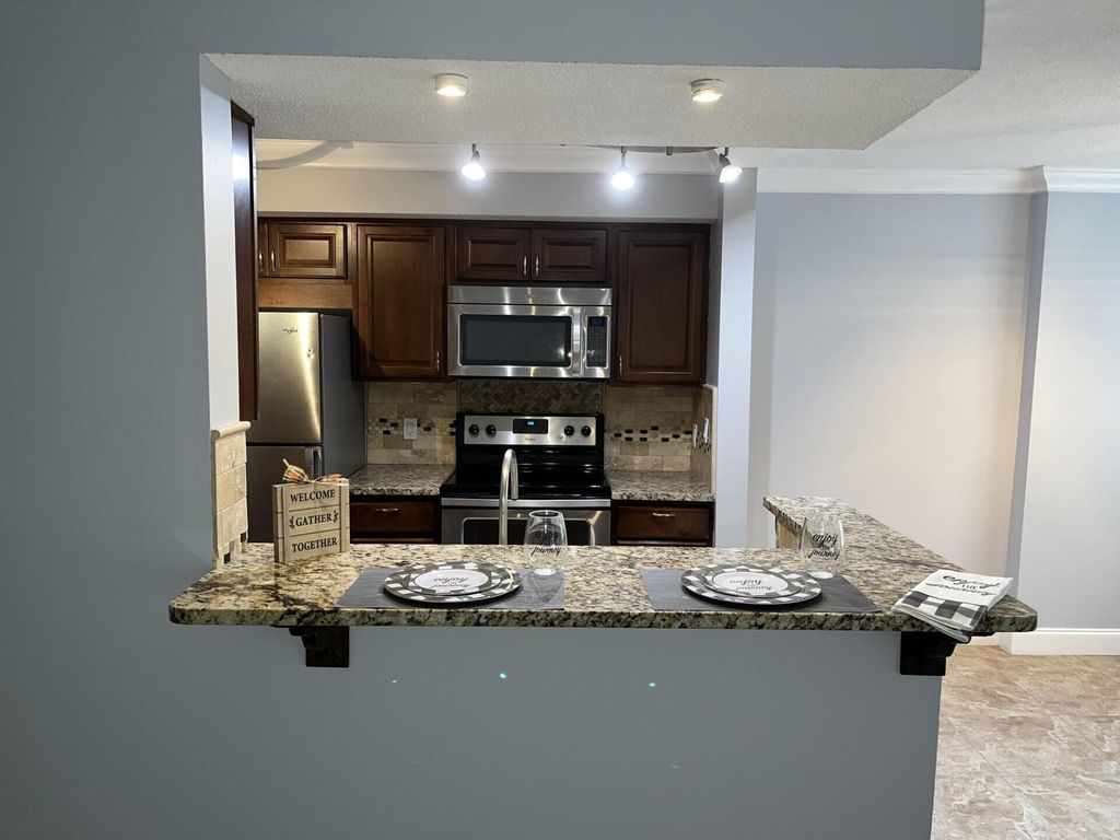 Photo of 815 W Boynton Beach Boulevard #9-102, Boynton Beach, FL 33426 (MLS # R10905513)