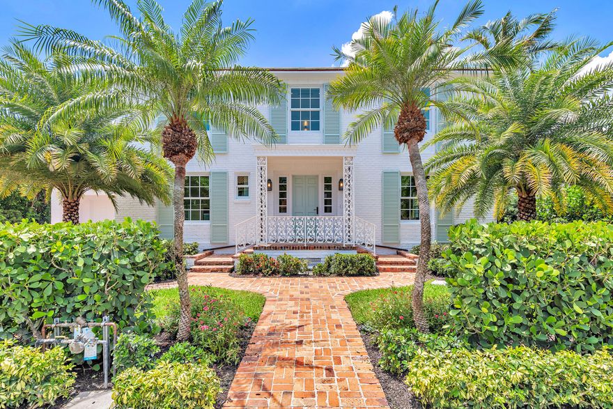 Located on a desirable in-town street, this 4,500-square-foot Palm Beach Island residence was originally designed by Gustav Maas and reimagined by Smith Kellogg Architecture with interiors by Carolyn Roy of CR Studio.Upon entering, the foyer opens to a formal living room with a fireplace, which flows into a bright sunroom overlooking the backyard. Adjacent is a dining room with a bay window that frames views of the pool and landscaped grounds.The kitchen is equipped with top-of-the-line appliances, including a full-size Sub-Zero refrigerator and freezer, gas range, and custom range hood, and pendant lighting reclaimed from the Netherlands. A walk-in butler's pantry with a wine refrigerator and additional storage sits directly behind. A door leads from the kitchen to the backyard