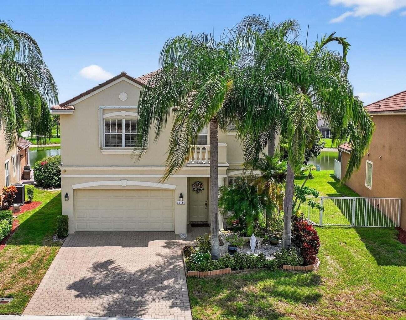 Welcome to 21196 Via Ventura, a rare lakefront estate in Boca Raton's desirable man-gated community of Mizner Pointe. This meticulously cared-for home blends refined design with Florida comfort, offering a lifestyle that's both elegant and effortless. The open floor plan is flooded with natural light, featuring soaring ceilings, crown molding, tile and recessed lighting throughout. The ground-floor master suite is a private retreat with his-and-hers custom closets, dual sinks, a soaking tub, and a separate stand-up shower. Every closet in the home is custom, with extra storage under the stairs and a spacious 2-car garage with room to organize.