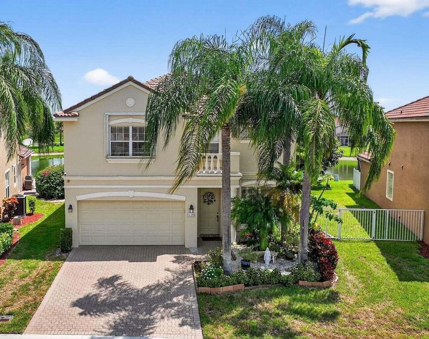 Welcome to 21196 Via Ventura, a rare lakefront estate in Boca Raton's desirable man-gated community of Mizner Pointe. This meticulously cared-for home blends refined design with Florida comfort, offering a lifestyle that's both elegant and effortless. The open floor plan is flooded with natural light, featuring soaring ceilings, crown molding, tile and recessed lighting throughout. The ground-floor master suite is a private retreat with his-and-hers custom closets, dual sinks, a soaking tub, and a separate stand-up shower. Every closet in the home is custom, with extra storage under the stairs and a spacious 2-car garage with room to organize.