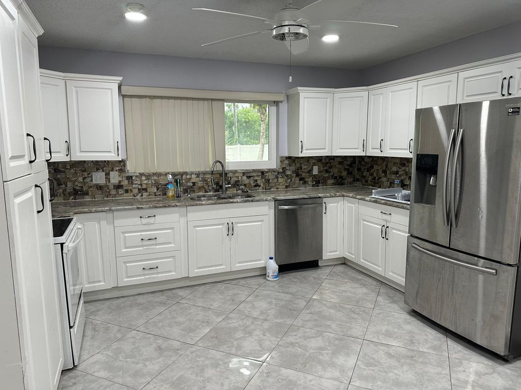 Photo of 1616 Crandon Avenue, Mangonia Park, FL 33407 (MLS # R11132252)