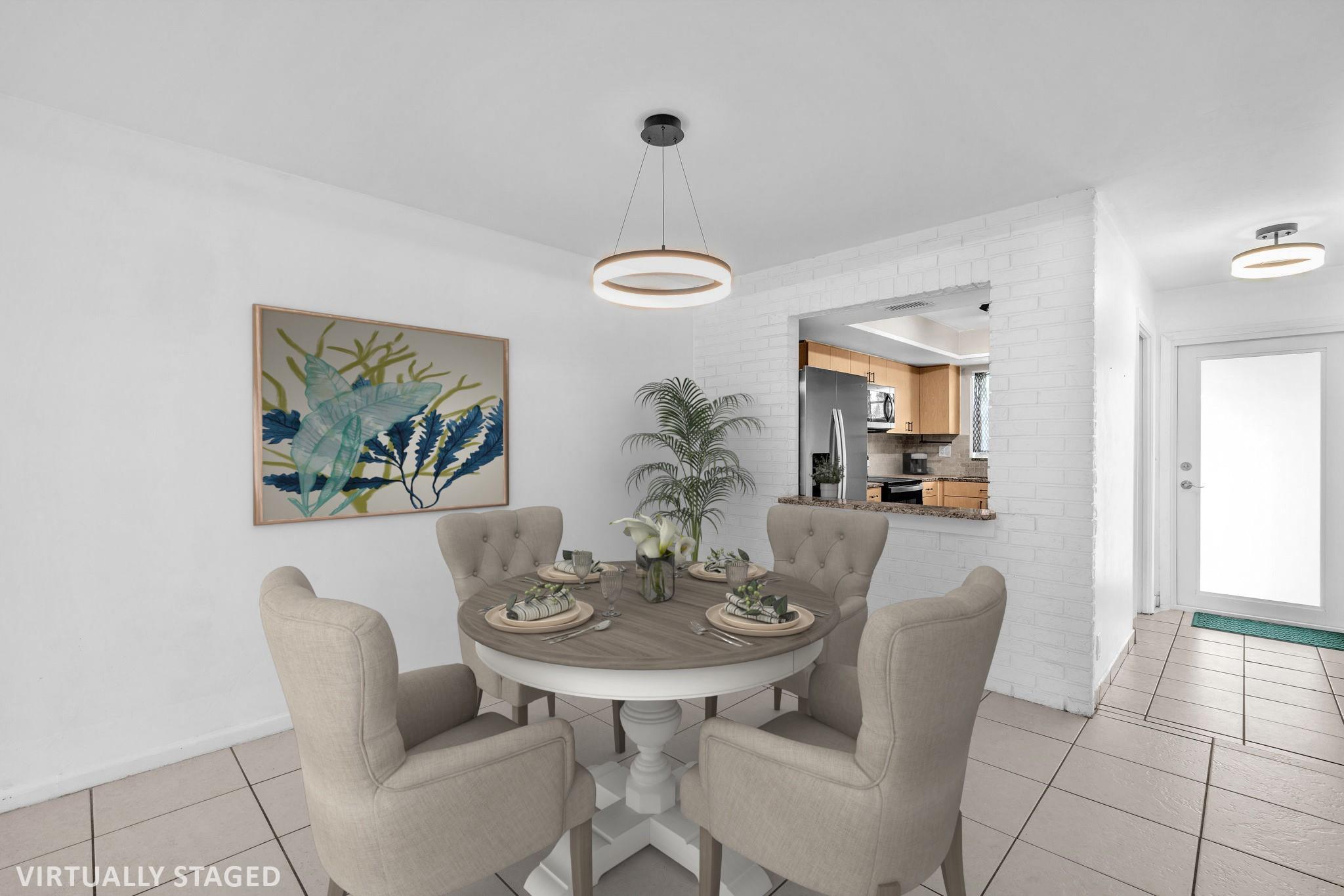 2/2 1 story CORNER villa in all ages community completely updated & ready for its next owner. Kitchen boasts granite countertops, newer stainless-steel appliances. Both bathrooms are updated! NEW Roof 2024, A/C 2017, water heater 2018. New hurricane IMPACT front door & new IMPACT windows! Screened patio w/washer & dryer (Can be moved back inside if buyer chooses) & fenced yard, great for pets. Extra storage locker in a communal storage building. Centrally located & neighborhood pedestrian bridge into Caloosa Park, a 64+acre park offering pickleball, soccer, biking, hiking trails, playground, bbqs & more. Shopping, dining & nightlife on Atlantic Ave, beaches minutes away. INVESTOR friendly, you can rent right away or first time home buyers! Water included & no assessments. 2 parking spots