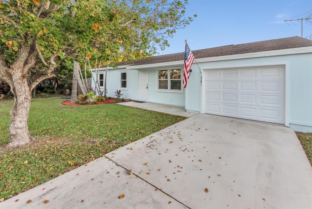 Photo of 2281 SE Baron Street, Port Saint Lucie, FL 34952 (MLS # R10762926)