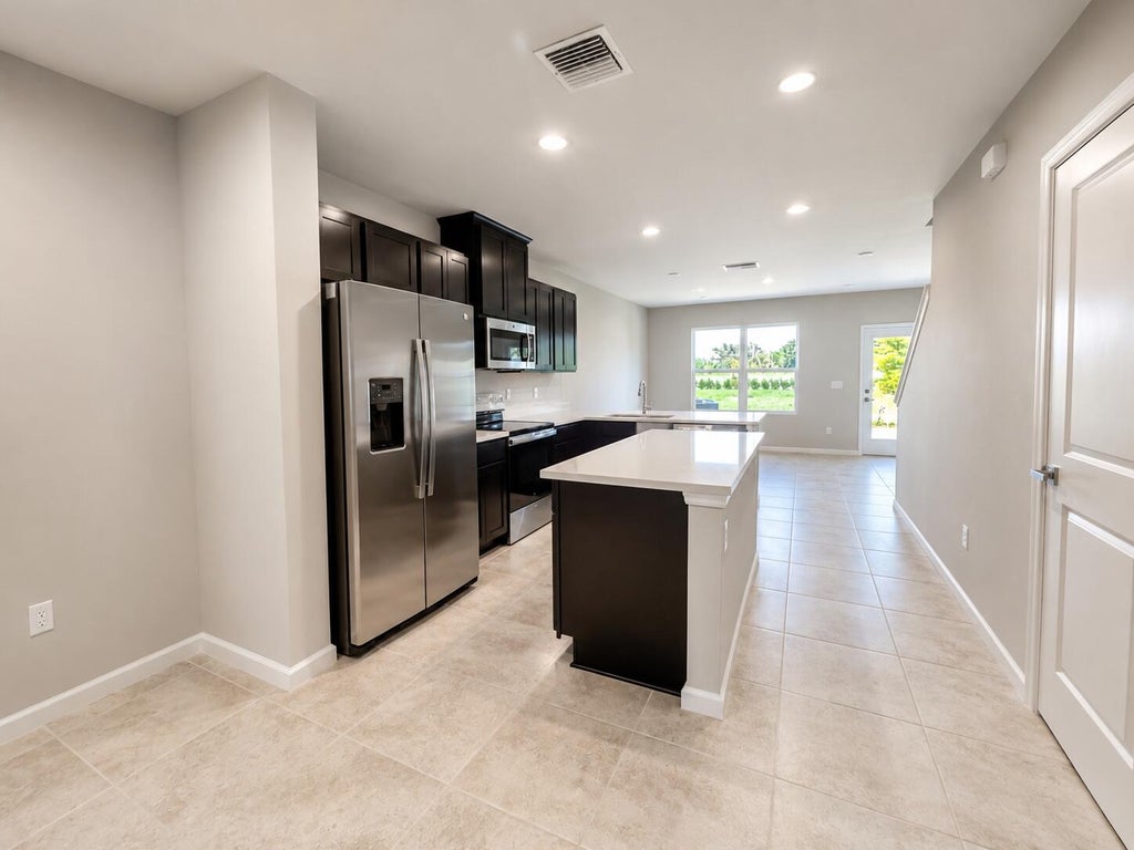 Photo of 100 Savannah Lakes Boulevard, Fort Pierce, FL 34982 (MLS # B26067870)