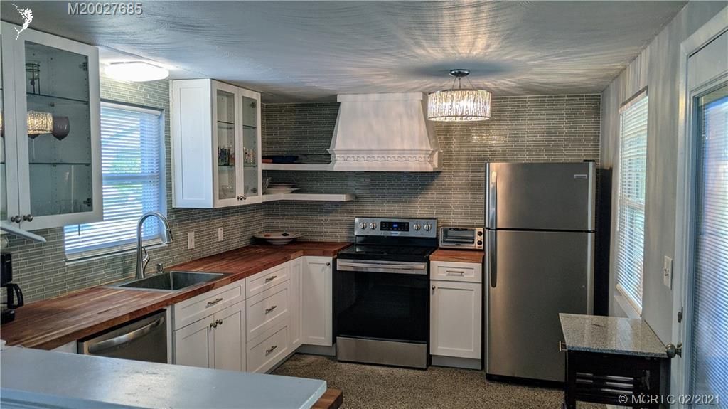 Photo of 1070 NE Martin Avenue, Jensen Beach, FL 34957 (MLS # R10689361)