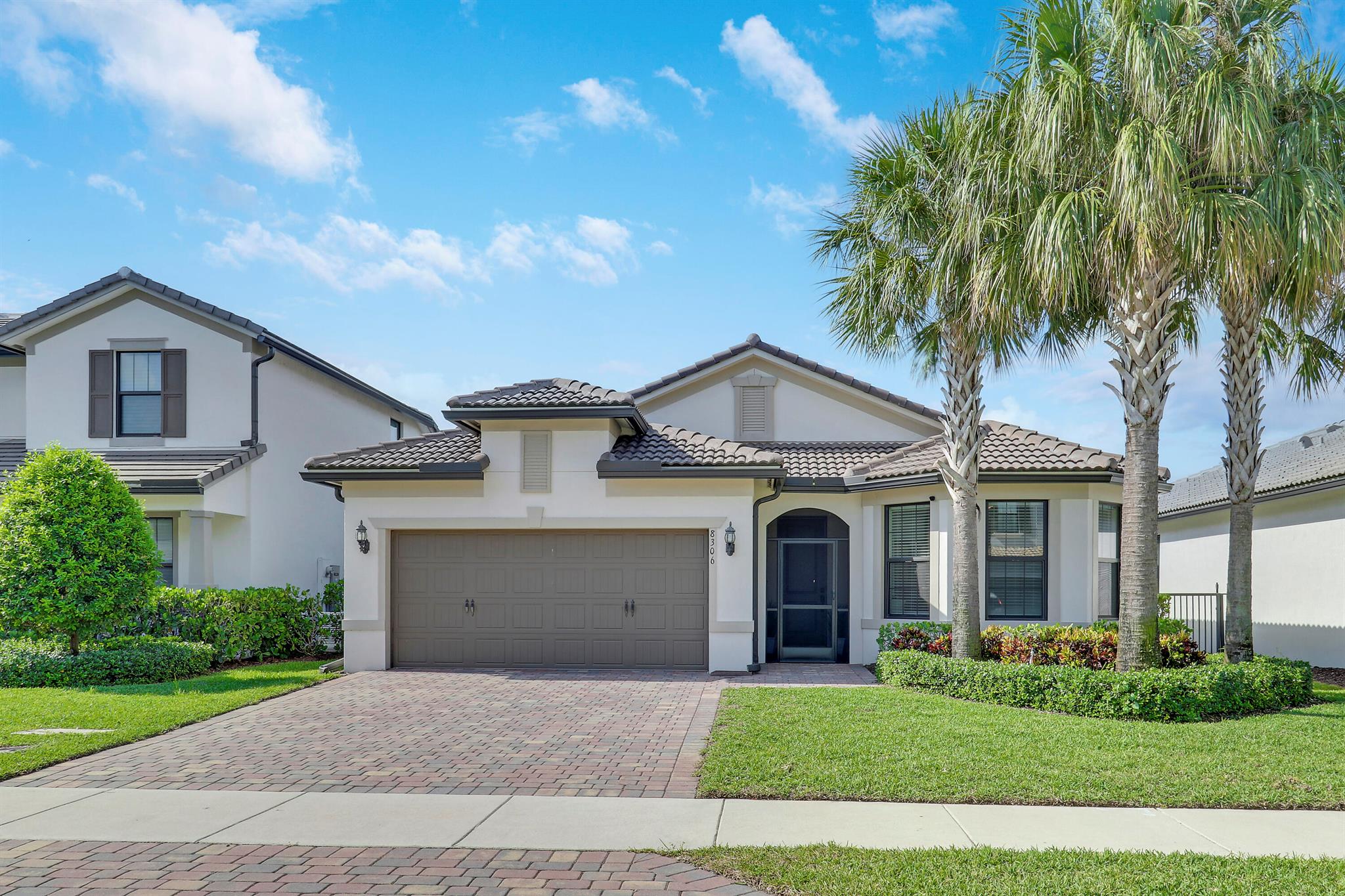 Welcome to this beautifully upgraded single-story Summerwood model offering 3 bedrooms plus a versatile den (currently used as a guest room), 2 bathrooms, and a 2-car garage with expanded storage space. Designed with coastal contemporary style and exceptional craftsmanship, this home blends modern luxury with everyday comfort.The open-concept floor plan features abundant natural light, plank-style tile flooring, high ceilings, and zero-point glass sliders that create a seamless transition to the outdoors. The gourmet kitchen is an entertainer's dream with quartz countertops, a large island, upgraded stainless steel appliances, a walk-in pantry, custom backsplash, and 42'' cabinetry.The spacious primary suite boasts serene lake views, a tray ceiling with recessed lighting, an