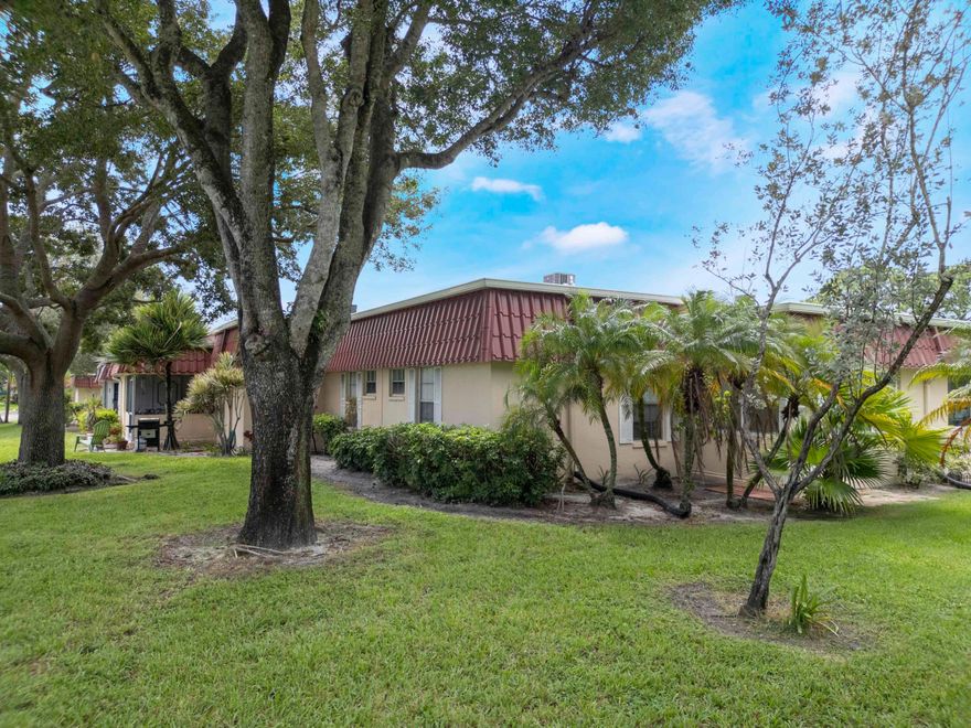 Welcome to this beautifully furnished corner villa in Covered Bridge, one of Lake Worth's most desirable 55+ communities. This private end-unit offers exceptional natural light, a peaceful garden view, and added privacy with no direct neighbor on one side. Move-in ready and well maintained, the home features tile flooring throughout (no carpet), a bright Florida room with new windows and A/C—perfect as a den, office, or additional living space—plus upgraded stainless steel appliances, in-unit washer & dryer, and extra storage. Enjoy the benefit of a low HOA that includes water, cable, internet, exterior maintenance, and access to community amenities, making this a very affordable and low-maintenance option. Covered Bridge offers resort-style living with two heated pools, clubhouse, fitness center, tennis, pickleball, bocce, billiards, library, and scenic walking paths. Pet-friendly community with assigned parking just steps from your door. Ideally located close to shopping, dining, major highways, Okeeheelee Park, and approximately 7 miles from the beach. Now competitively priced, this is an exceptional opportunity for both seasonal and year-round living in a well-established community.