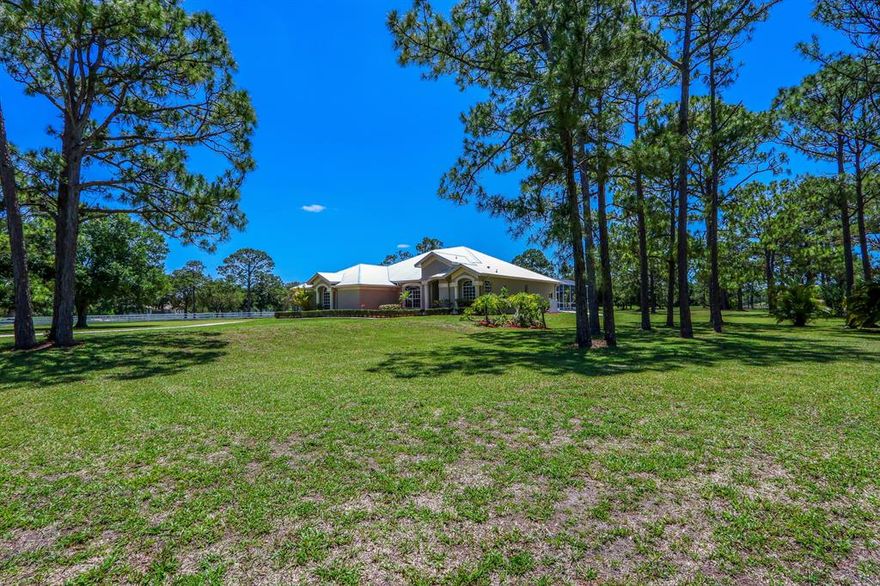 Located in Stuart West. Four bedroom (plus den), three bathroom Arthur Rutenberg built custom home on 4+ acres with double door front entry & transom window, volume ceilings, tray ceiling, fireplace, pool, 3 car garage and additional detached RV/Boat garage. New metal roof (December 2020), freshly painted exterior & interior, new carpeting, updated electrical outlets, switches & LED lighting, kitchen with wood cabinetry, granite countertops, stainless steel appliances, center island, breakfast bar, breakfast nook, bathrooms with some updates, new door locks throughout, newer water system equipment, irrigation system, some landscaping updates and golf course view. First time on market - original owner.