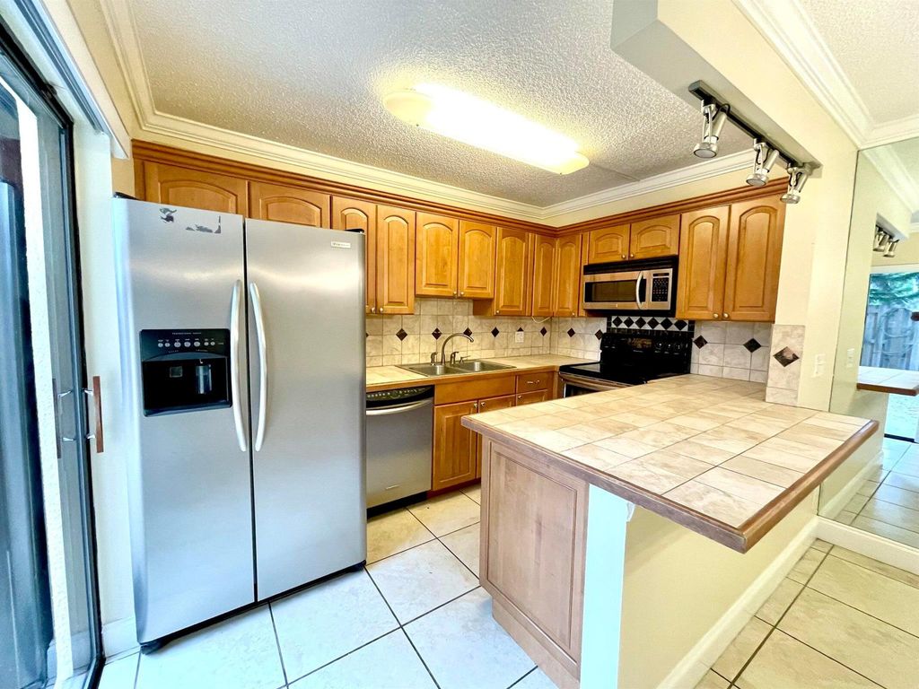 Photo of 221 Lake Arbor Drive, Palm Springs, FL 33461 (MLS # R11096642)