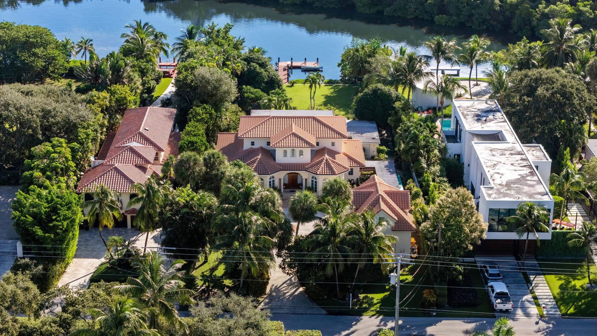 Experience unparalleled waterfront living on Hypoluxo Island! This sprawling 31,000+ square foot lot on North Atlantic Drive embodiesthe essence of peace, privacy, and the pinnacle of coastal living. This exceptional waterfront home offers direct ocean access with no fixed bridges and is just a short walk from the prestigious 5-star Eau Hotel and Spa, pristine beaches, and world class shopping and dining. With 100-feet of prime intracoastal frontage, this custom-built Mediterranean estate designed by acclaimed architect Roger Janssen features 100% CBSconstruction with stem-wall foundation and is equipped with whole house high-impact windows and doors. Additionally, the home features 5 total bedrooms, 4 and a half baths, library, a heated saltwater pool, dockage with water and electric