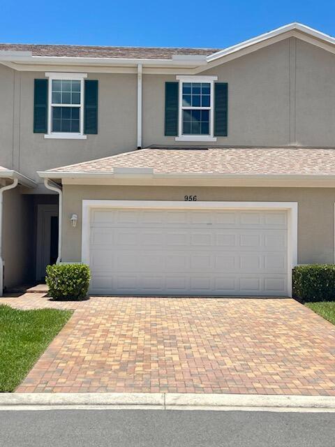 *SELLER TO CREDIT BUYER 6 MONTHS HOA FEES AT CLOSING.BRAND NEW FLOORING INSTALLED ON UPSTAIRS & ALL BEDROOMS *. . Beautiful 3 BEDROOM 2 AND 1/2 BATH TOWNHOME WITH IMPACT GLASS WINDOWS , FRESHLY PAINTED INSIDE with OPEN CONCEPT KITCHEN WITH WHITE CUSTOM 42'' Cabinets, STAINLESS APPLIANCE PACKAGE WITH WASHER & DRYER. LONG EXTENDED SCREENED IN BACK PORCH THAT FACES NORTH SO MINMAL SUN EXPOSURE ON PORCH. NICELY LANDSCAPED TREE LANDSCAPE IN BACK WITH SPACE SEPARATION FROM OTHER BUILDINGS FOR MORE PRIVACY. CLUBHOUSE AMENITIES WITH POOL, GYM AND BEAUTIFUL NATURE TRAILS TO ST. LUCIE RIVER .