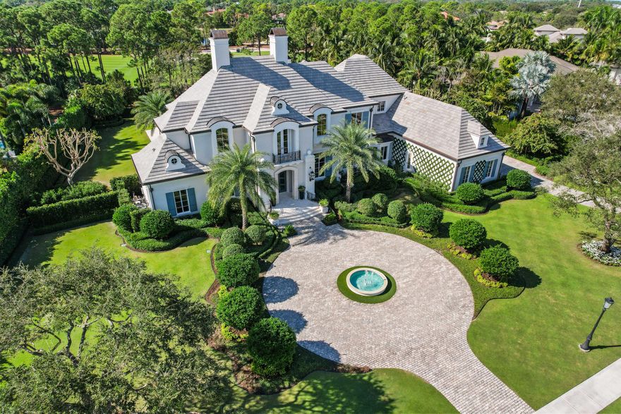 This stunning home, nestled on a 1-acre plot within the prestigious Old Palm Golf Club, emanates European elegance. Encompassing over 8000 sf, it features five bedrooms, including a spacious second floor primary suite with separate bath and dressing rooms, two offices, a temperature controlled wine room, elevator, attached guest house and a four-car garage. Meticulously detailed, the residence caters to the most discerning buyers who appreciate exquisite craftsmanship. Recent enhancements span electrical, audiovisual, and landscaping, elevating the home's allure. Beyond the confines of this luxurious abode, Old Palm Golf Club beckons with its renovated clubhouse, a new 20,000 sf. Lifestyle center, and top-notch amenities (two story fitness facility, four lane outdoor lap pool, state of the art spa, kids club, cafe), solidifying its status as one of the premier clubs in South Florida. Membership mandatory with this home.