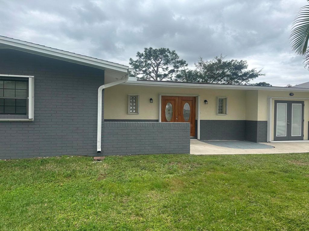 Photo of 950 SE Belfast Avenue, Port Saint Lucie, FL 34983 (MLS # R10952486)