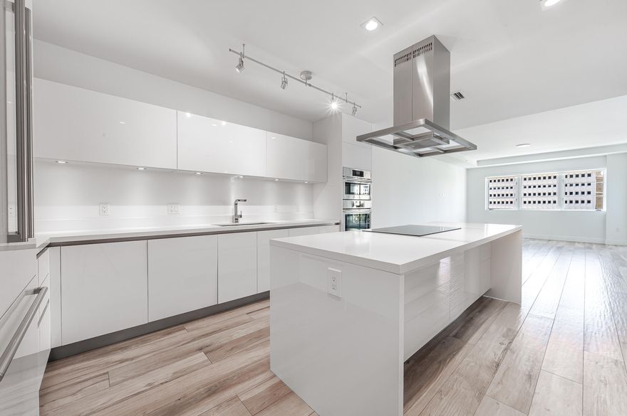 Spacious residence with an open concept floor plan, featuring 2 bedrooms plus a den and 2.5 baths. Enjoy great natural light with direct South Exposure. Private electric charging station comes with 2 premium parking spaces. Custom features like upgraded custom kitchen, motorized shades, custom built-out closets and 10-foot ceilings throughout. The oversized master bedroom features a large walk in closet and spa like master bathroom with separate soaking tub and shower. The 2nd bedroom is a generous size with en-suite bathroom and the Den is perfect for a media room or office. Large walk in Laundry room with a lot of storage. Two Balconies with South exposure, one off of the master bedroom and another off of the great room. Tower 155 is a luxury condo building situated in the heart of downtown Boca Raton, with Mizner Park, shopping, dining, elite golf courses, pristine beaches and The Boca Raton Resort all nearby. Just like living in a resort or 5 star hotel with every luxury, amenities and services you could imagine. Fantastic walkability and conveniently located in the center of Downtown. Building completely designed by Steven G including the lobby with 24 hour front desk, concierge, valet, resort style pool, hot tub, sundeck overlooking Mizner Park, vibrant bar scene and private cabanas, gym, sauna and steam room, Starbucks business lounge, hairstyling and manicure station and smart building technology. Dine in or take out at Boca's finest restaurants, all within walking distance.