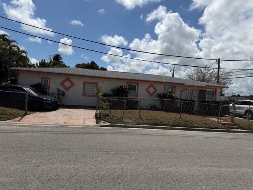 Photo of 1585 W 36th Street, West Palm Beach, FL 33404 (MLS # B26002717)