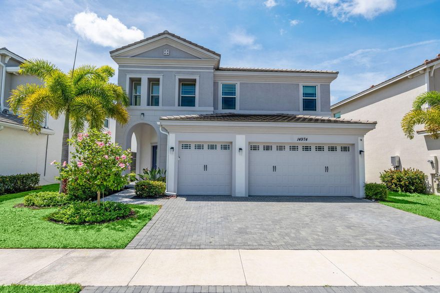 Experience modern luxury in this stunning 2023-built residence located in the highly sought-after Orchards of Westlake.Offering $150,000+ worth of upgrades throughout, including a water filtration system, this home perfectly blends contemporary elegance with everyday functionality. The gourmet kitchen is a true showpiece, featuring quartz countertops, upgraded appliances, oversized pantry, and a custom-built breakfast nook designed for style and comfort. The expansive great room is anchored by a custom, built-in entertainment center and fireplace, creating the perfect space for entertaining or relaxing with loved ones. Located in one of Palm Beach County's premier master-planned communities, Westlake residents enjoy resort-style amenities including pools, waterslides, playgrounds & more!