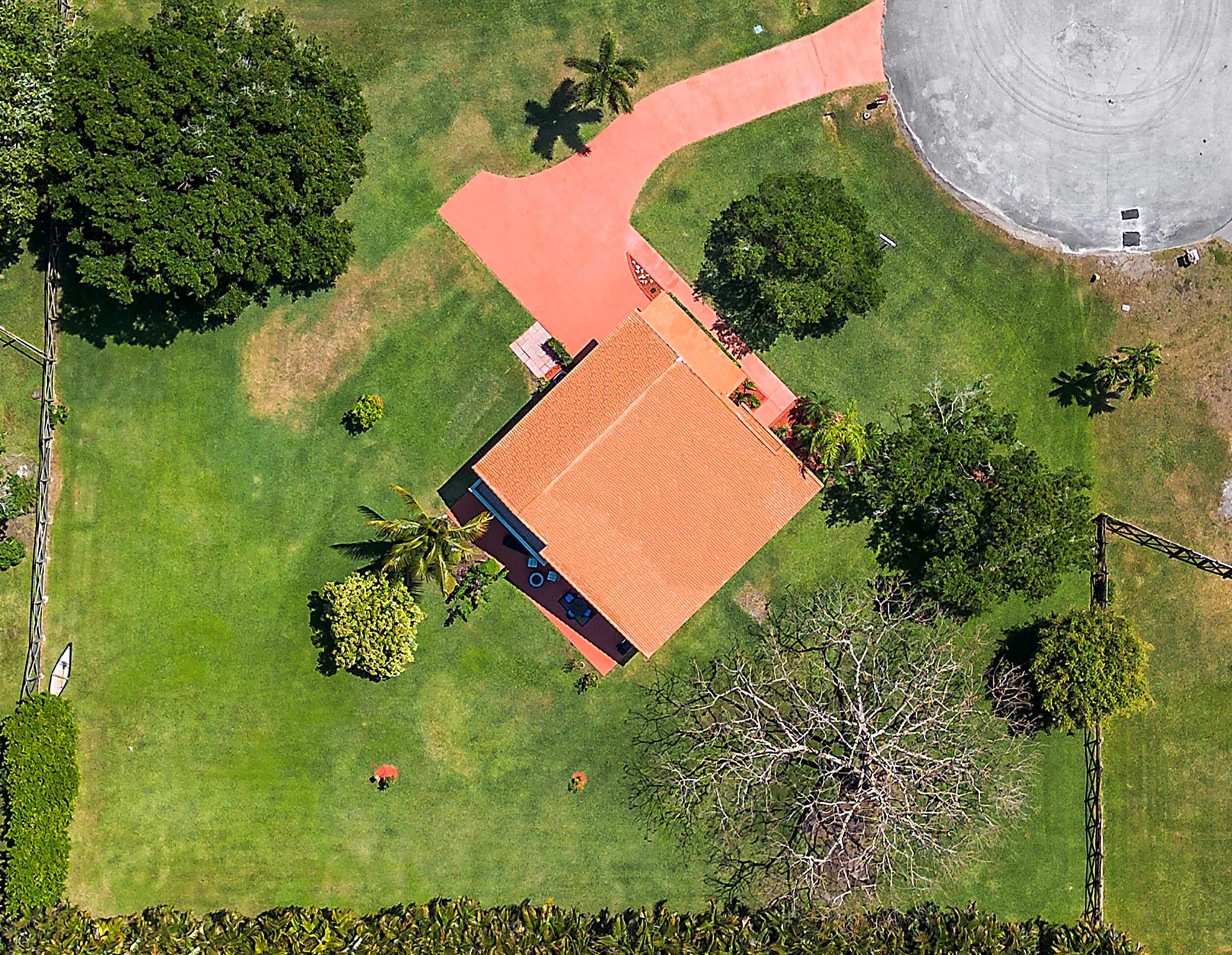 Nestled in The Trails in a quiet cul-de-sac Has HOA $30 Monthly only can build in law suite or workshop if wanted on an expansive 0.87-acre lot with multiple fruit trees, this stunning 4-bedroom, 2.5-bath home offers 2,593 sq. ft. of thoughtfully designed living space. A huge concrete driveway provides ample parking for up to 10 cars or an RV, while the beautifully landscaped surroundings create a peaceful retreat. Step inside to find porcelain tile flooring in the living areas, soaring 20+ ft. ceilings, and automated blinds enhancing the home's modern appeal. The fully remodeled kitchen boasts stainless steel appliances (2023), a large vent hood over the stove, Porcelain countertops, a wine cooler, extra bar cabinet space, and recessed lighting.