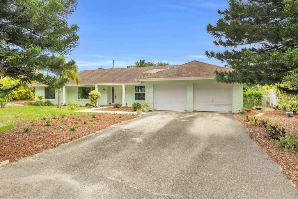 Photo of 313 Country Club Drive, Tequesta, FL 33469 (MLS # R11098807)