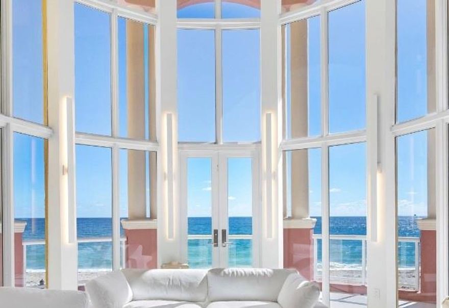 Enter your oceanfront townhome residence through a private gated entry and discover one of only seven exclusive 4,000+ sq. ft. oceanfront homes set directly on the sand. Spanning four levels and connected by a private elevator, this smart home pairs refined design with effortless luxury. Enjoy multiple ocean-view terraces, an outdoor plunge pool, and sophisticated interiors featuring Miele and Sub-Zero appliances, waterfall countertops, and custom finishes throughout. The primary suite crowns the home with dual ocean and sunset balconies, separate shower and bath, and expansive walk-in closet. Residents indulge in resort-style amenities including two pools, a two-story fitness center, tennis, racquetball, and more—an exceptional blend of privacy and coastal elegance.