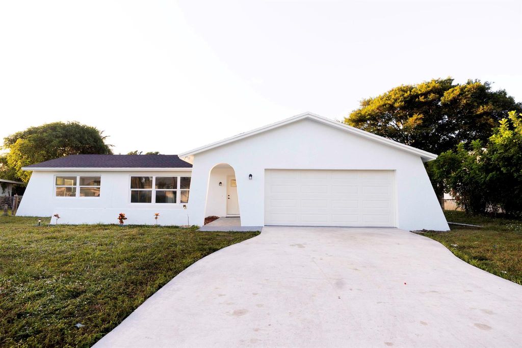 Photo of 1616 Sherwood Drive, Mangonia Park, FL 33407 (MLS # R10935383)