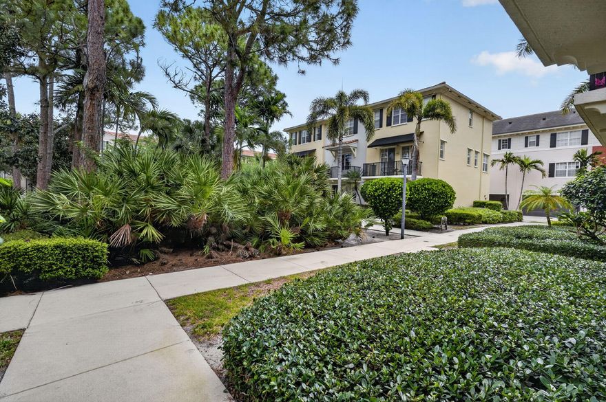 Stunning,  pristine three bedroom, three and half bath residence located in the highly desirable Greenwich neighborhood of Abacoa. This rarely available home offers a thoughtfully designed layout with exceptional finishes throughout.  The first floor features a private bedroom with a full bath and walk-in closet—ideal for guests or a home office. The main living level showcases a stunning chef's kitchen complete with quartzite countertops, custom cabinetry, and designer hardware. The open concept space flows beautifully into a light-filled dining area and living room, highlighted by a custom built entertainment center and an impressive 80 inch TV perfect for entertaining. A powder room is also conveniently located on this level, along with a charming balcony overlooking a peaceful  courtyard fountain—an ideal spot to relax with your morning coffee.  Upstairs, you'll find two additional bedrooms, including a spacious primary suite featuring dual closets and a large ensuite bath with double vanities, a separate walk-in shower, private water closet, and an additional walk-in closet.  Additional features include full hurricane-impact windows, new smoke detectors, and a two-car garage w/epoxy flooring for added convenience and peace of mind.  Residents of Abacoa enjoy close proximity to Roger Dean Chevrolet Stadium, as well as an array of restaurants, shopping, golf, tennis, pickleball, and community events, including concerts and food trucks at the amphitheater. Zoned for A-rated schools, this home offers the perfect blend of luxury, lifestyle, and location.  A truly exceptional opportunity, available July 5th.