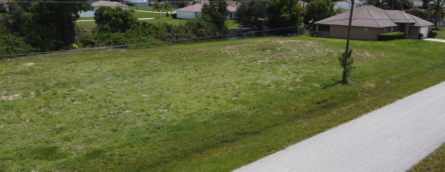 Attention Builders, Developers, and Agents!Your next project awaits! This prime lot offers an exceptional opportunity to build a beautiful single-family home in a desirable Cape Coral neighborhood. Per the previous owner, the builder prepared an area tabulation with the following approximate measurements: 1,718 sq ft living, 435 sq ft garage, 157 sq ft lanai, and 37 sq ft entry, totaling 2,347 sq ft (buyer to verify).A 2005-built seawall is already in place--an excellent advantage for waterfront construction.Cape Coral is one of Florida's fastest-growing cities, celebrated for its stunning beaches like Sanibel Island, picturesque parks, dog-friendly trails, and unmatched coastal lifestyle. Don't miss this opportunity. Lot Sold ''AS IS.''